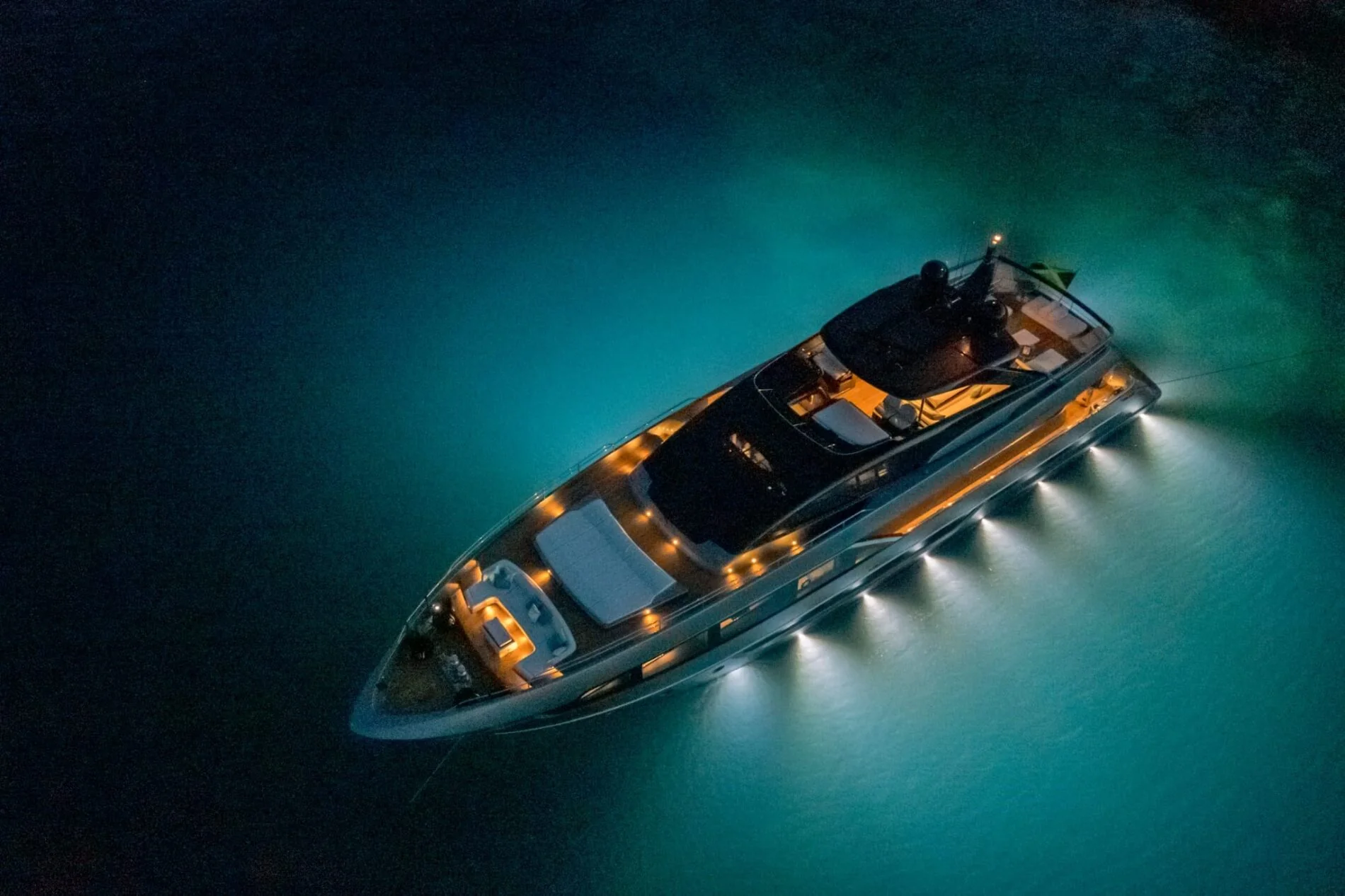 YOYITA II illuminated at anchor after sunset